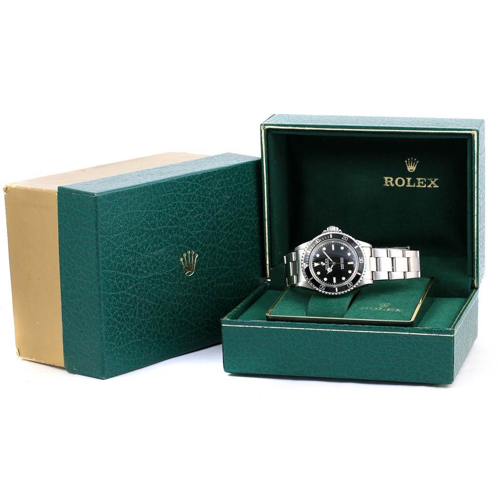 The Rolex Vintage Collection 5513 Men
s Stainless Steel Black Dial 5513 Men
s Stainless Steel Black Dial watch is shown from the front, displayed in its original box with logo and documentation visible.