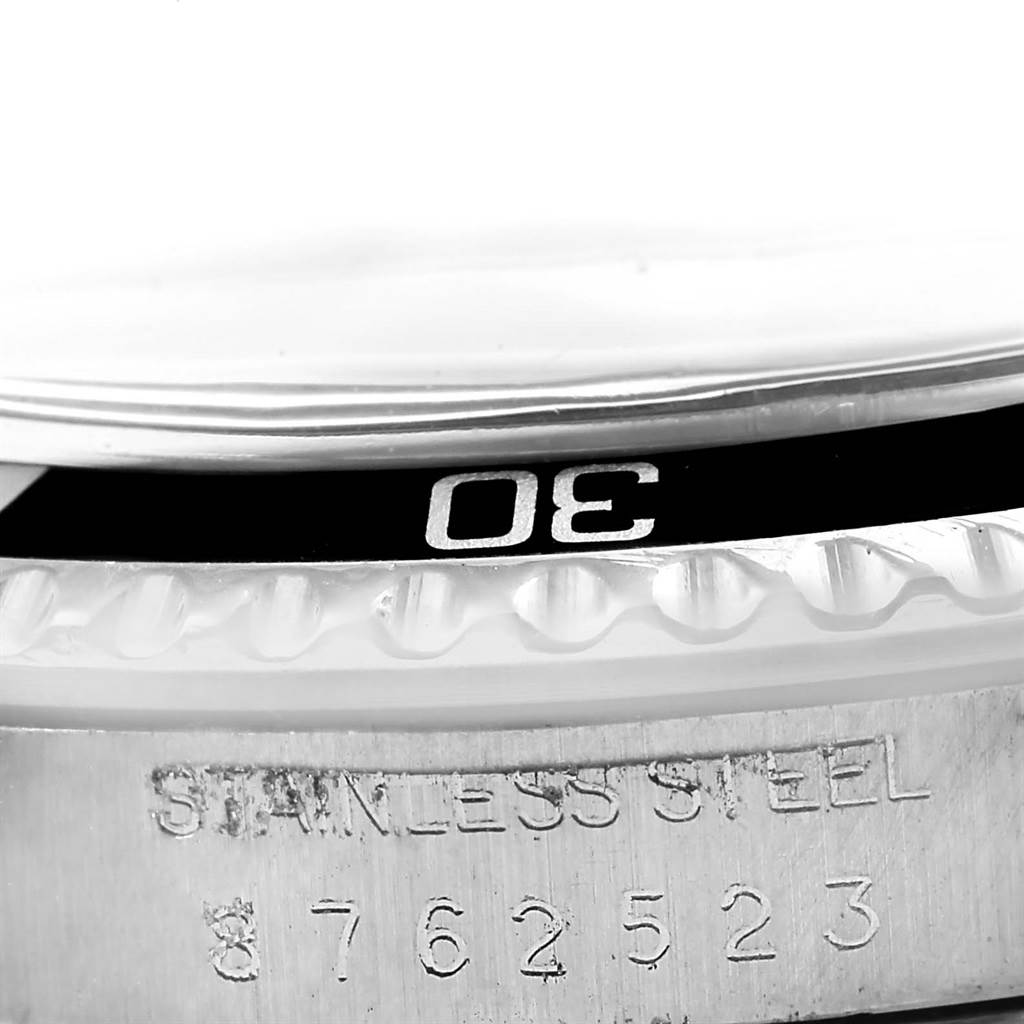 The image shows a close-up of the bezel and serial number engraving of a Rolex Vintage Collection 5513 Men
s Stainless Steel Black Dial 5513 Men
s Stainless Steel Black Dial watch.