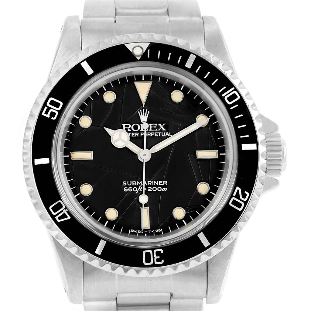 The image shows a front view of a Rolex Vintage Collection 5513 Men
s Stainless Steel Black Dial 5513 Men
s Stainless Steel Black Dial Submariner watch, highlighting its dial, bezel, and bracelet.