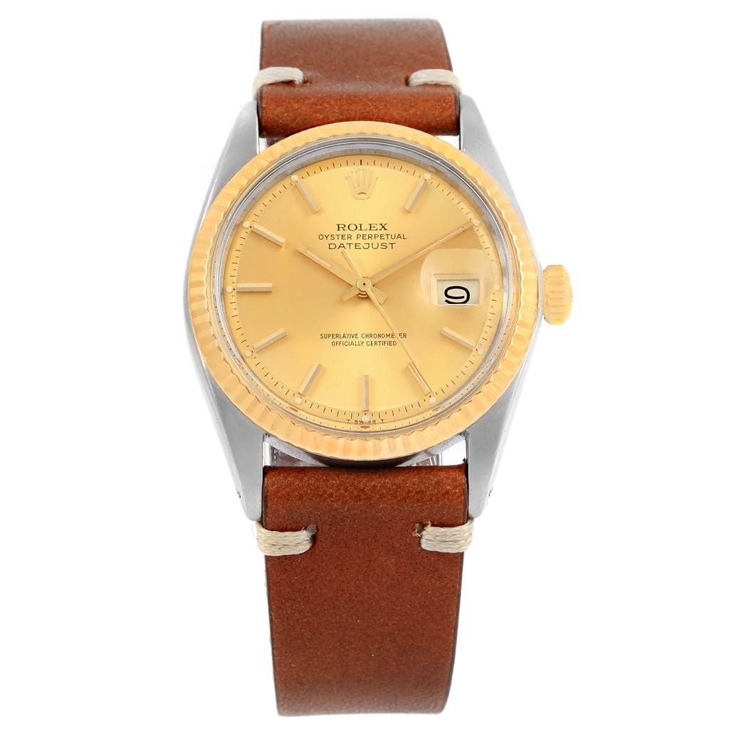 This image shows a front view of a Rolex Vintage Collection 1601 Men's Steel and Gold (two tone) Champagne Dial 1601 Men's Steel and Gold (two tone) Champagne Dial Datejust watch with a brown leather strap.