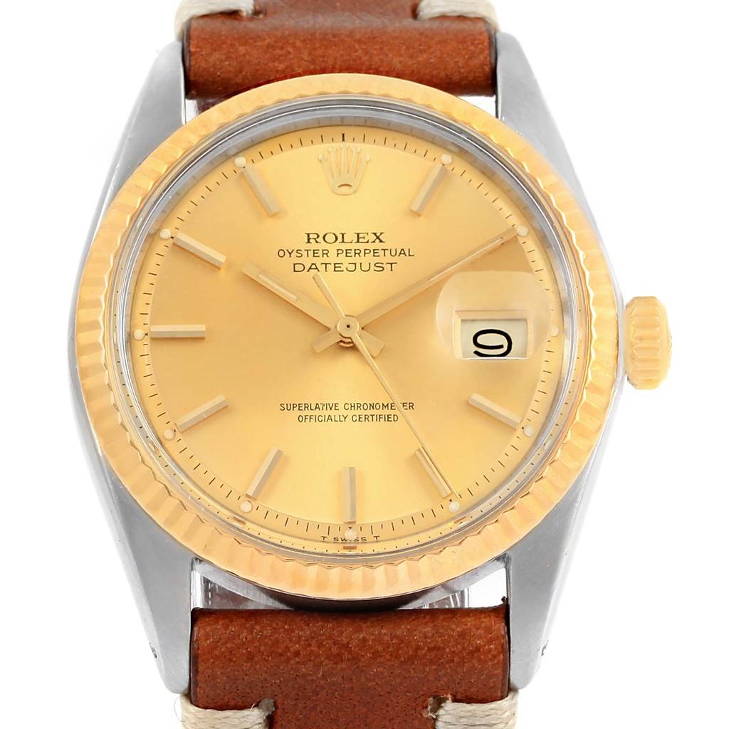 This image shows a Rolex Vintage Collection 1601 Men's Steel and Gold (two tone) Champagne Dial 1601 Men's Steel and Gold (two tone) Champagne Dial Datejust watch from a front angle, highlighting its face, bezel, crown, and leather strap.