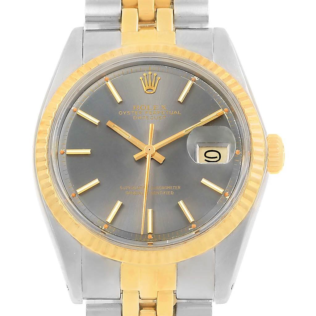 The image shows a front view of the Rolex Vintage Collection 1601 Men's Steel and Gold (two tone) Grey Dial 1601 Men's Steel and Gold (two tone) Grey Dial watch, featuring a grey dial, gold indices, and a two-tone metal bracelet.