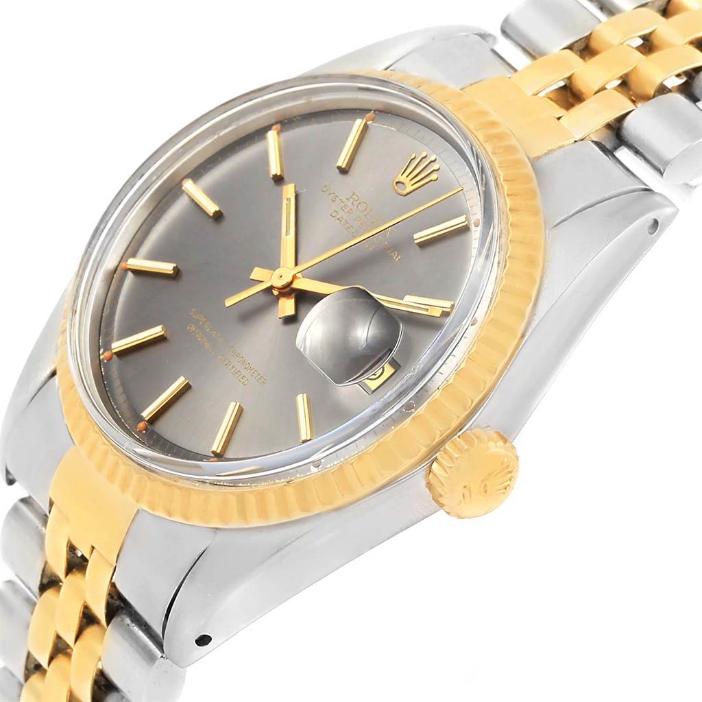 The Vintage Collection Rolex watch is shown at an oblique angle highlighting its dial, case, crown, and part of the bracelet.