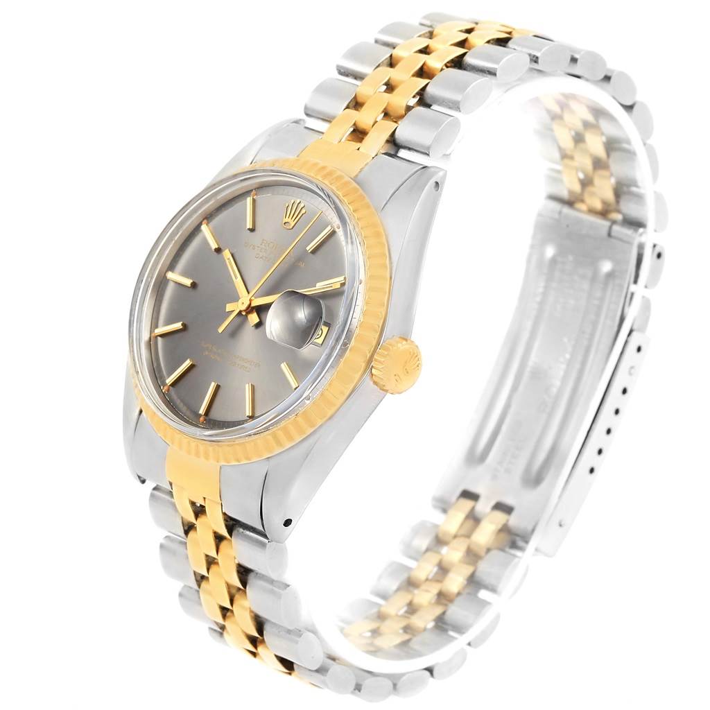 The image shows a Rolex Vintage Collection 1601 Men's Steel and Gold (two tone) Grey Dial 1601 Men's Steel and Gold (two tone) Grey Dial watch at an angle highlighting its band, face, crown, and clasp.