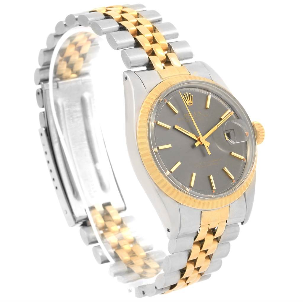 The Rolex Vintage Collection 1601 Men's Steel and Gold (two tone) Grey Dial 1601 Men's Steel and Gold (two tone) Grey Dial watch is shown at a high angle, featuring the two-tone bracelet, dial, and crown.