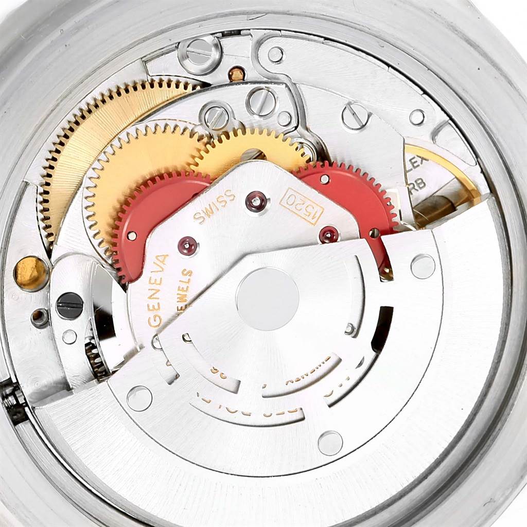 The image shows the internal mechanical parts of a Vintage Collection Rolex watch from a close-up angle.