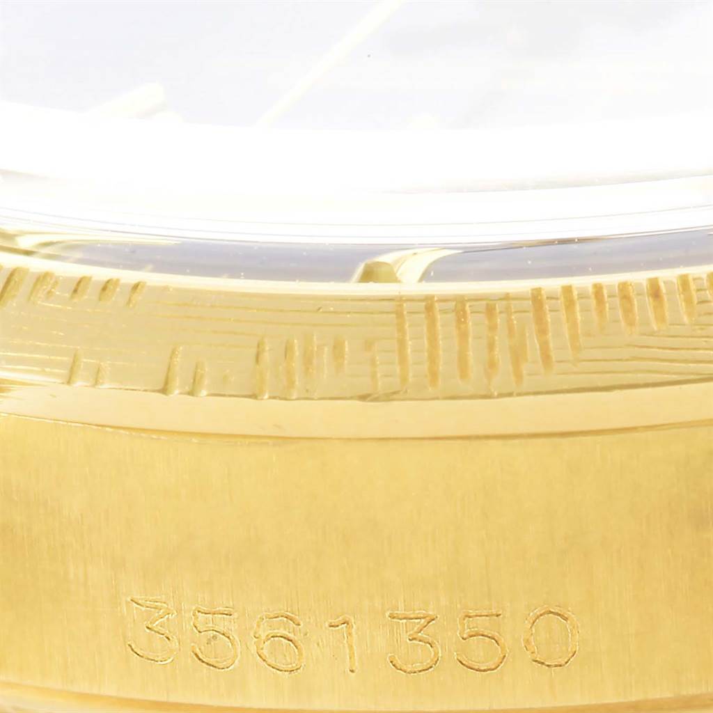 The image is a close-up of the serial number on the gold case side of a Rolex Vintage Collection 1513 Men's Yellow Gold Black Dial 1513 Men's Yellow Gold Black Dial watch.