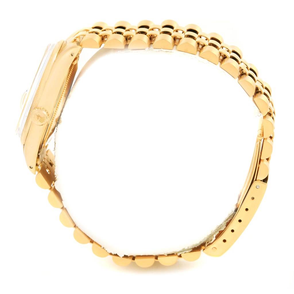 This side-view image shows the bracelet and side case of a Rolex Vintage Collection 1513 Men's Yellow Gold Black Dial 1513 Men's Yellow Gold Black Dial model watch.