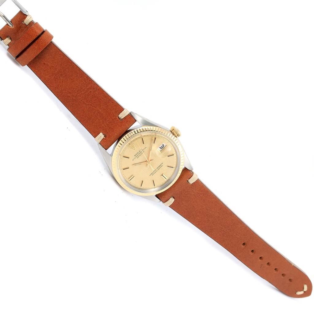 The watch is a Rolex Vintage Collection 1601 Men's Steel and Gold (two tone) Champagne Dial 1601 Men's Steel and Gold (two tone) Champagne Dial model, shown from a top-down angle, displaying the face, band, case, and buckle.