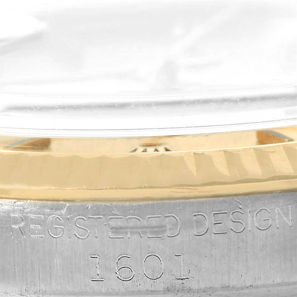 This close-up image shows the side view of the Rolex Vintage Collection 1601 Men's Steel and Gold (two tone) Champagne Dial 1601 Men's Steel and Gold (two tone) Champagne Dial watch case, focusing on the model number 1601 and part of the bezel.