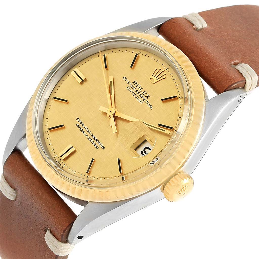 The Rolex Vintage Collection 1601 Men's Steel and Gold (two tone) Champagne Dial 1601 Men's Steel and Gold (two tone) Champagne Dial model watch is shown at a slight angle, displaying its gold dial, bezel, and brown leather strap.