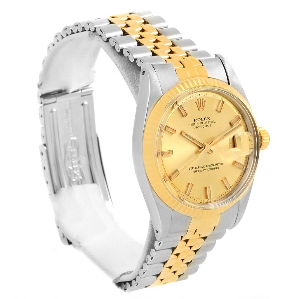 The image shows a side view of the Rolex Vintage Collection 1601 Men's Stainless Steel Champagne Dial 1601 Men's Stainless Steel Champagne Dial watch, featuring its gold and silver bracelet and dial.