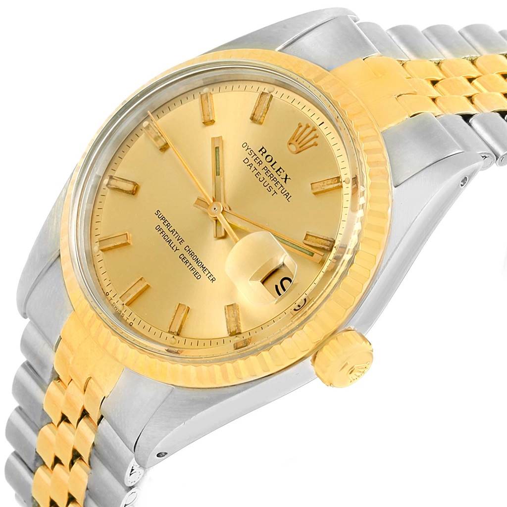 This image shows a side angled view of the Rolex Vintage Collection 1601 Men's Stainless Steel Champagne Dial 1601 Men's Stainless Steel Champagne Dial watch, detailing its gold dial, bezel, and part of the bracelet.