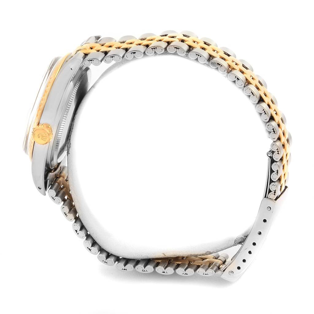 This image shows a side view of the Rolex Vintage Collection 1601 Men's Stainless Steel Champagne Dial 1601 Men's Stainless Steel Champagne Dial watch, highlighting its bezel, case, crown, and two-tone bracelet.