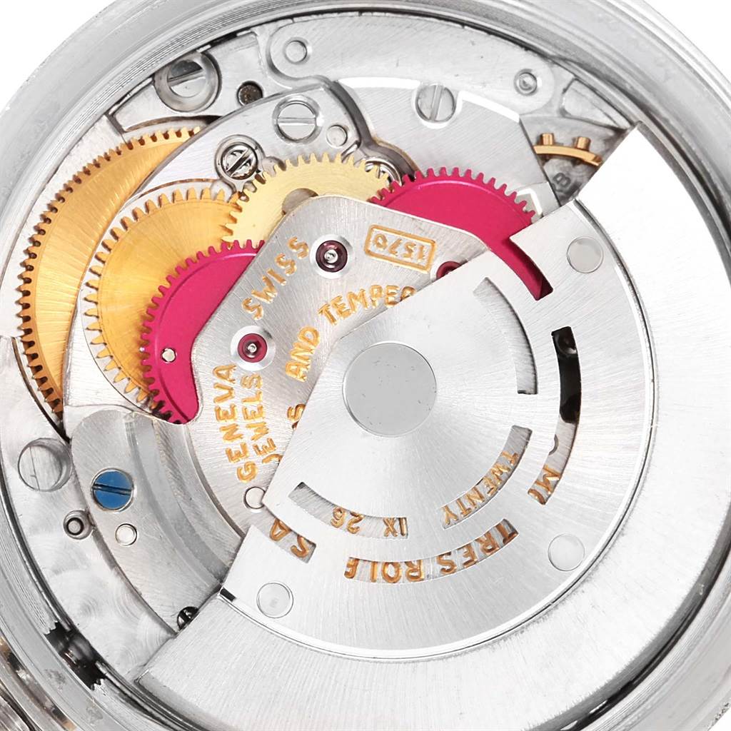 The image shows the inner machinery and intricate components of a Rolex Vintage Collection 1601 Men's Stainless Steel Champagne Dial 1601 Men's Stainless Steel Champagne Dial watch movement viewed from the back.