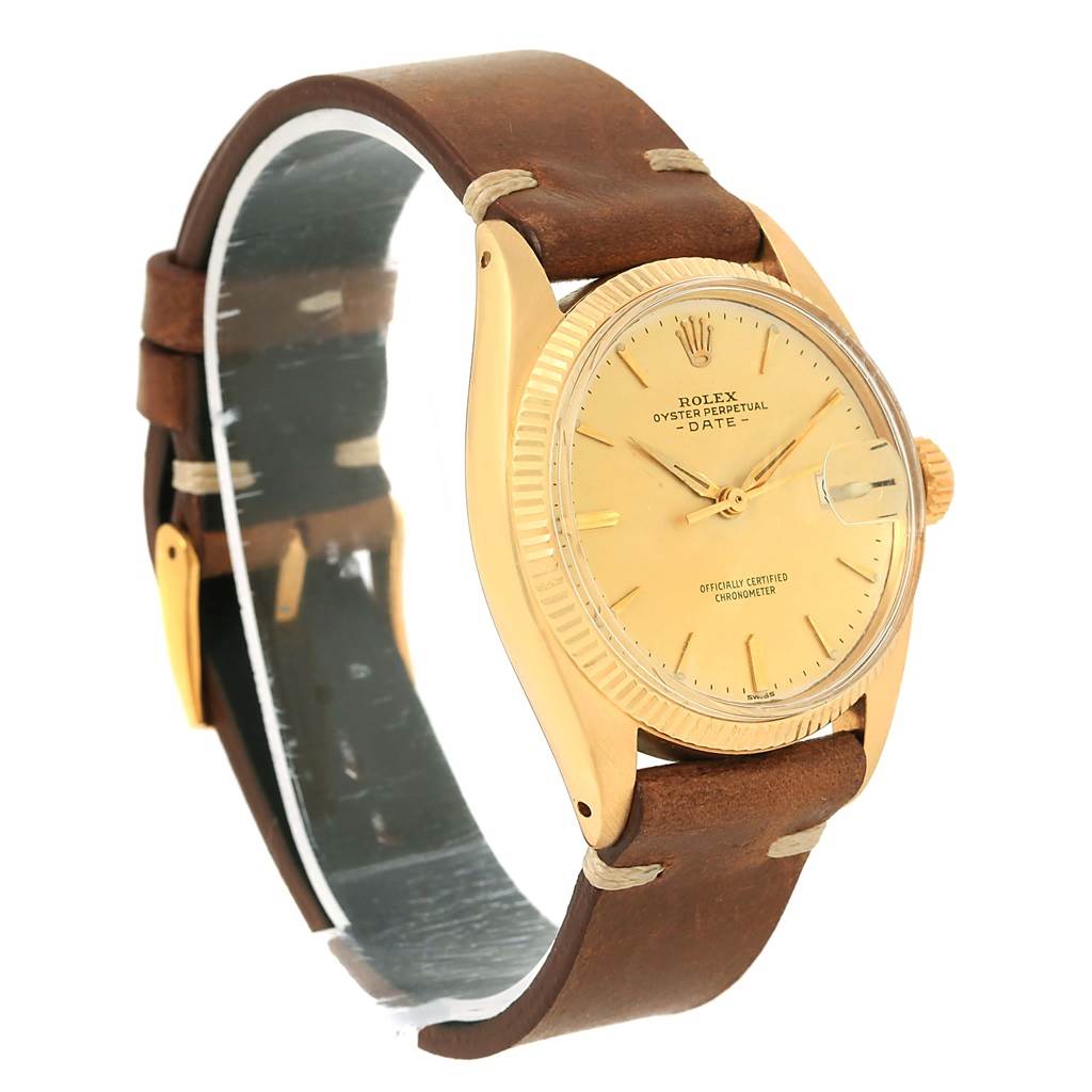 This is a side view of the Rolex Vintage Collection 6537 Men's Yellow Gold Champagne Dial 6537 Men's Yellow Gold Champagne Dial watch, showcasing its brown leather strap and gold-tone case and dial.