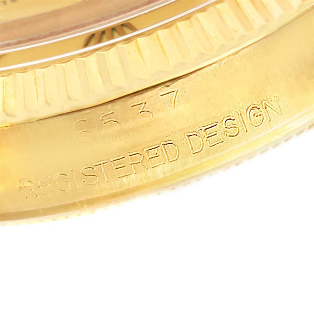 This image shows an angled close-up of the case side of a Vintage Collection Rolex watch, highlighting the engraved model number.