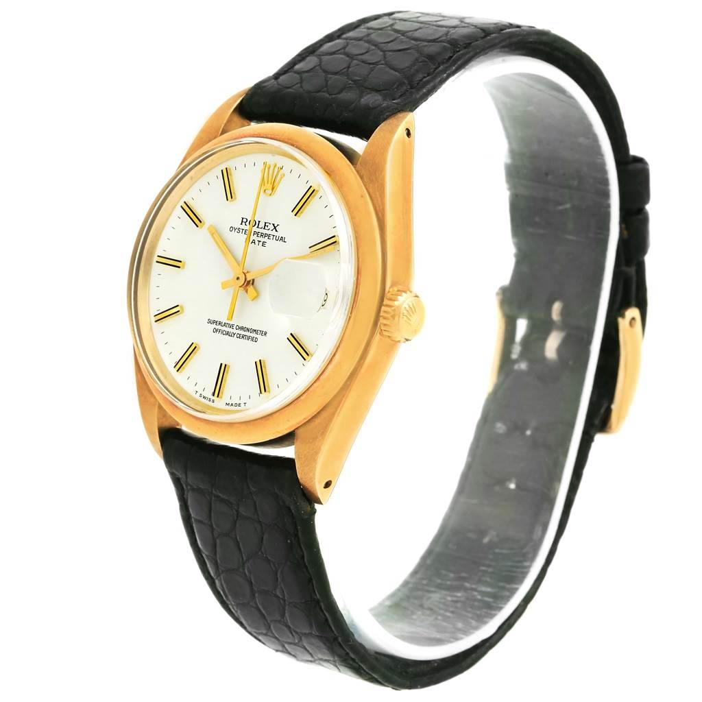 The Rolex Vintage Collection 1500 Men's Yellow Gold White Dial 1500 Men's Yellow Gold White Dial watch is angled to show the face, crown, and part of the black leather strap.