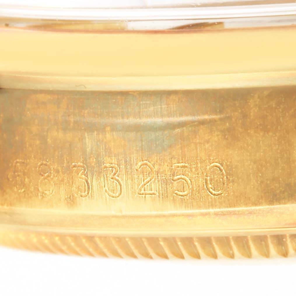 The image shows a close-up of the serial number engraving on the case of a Rolex Vintage Collection 1500 Men's Yellow Gold White Dial 1500 Men's Yellow Gold White Dial watch.