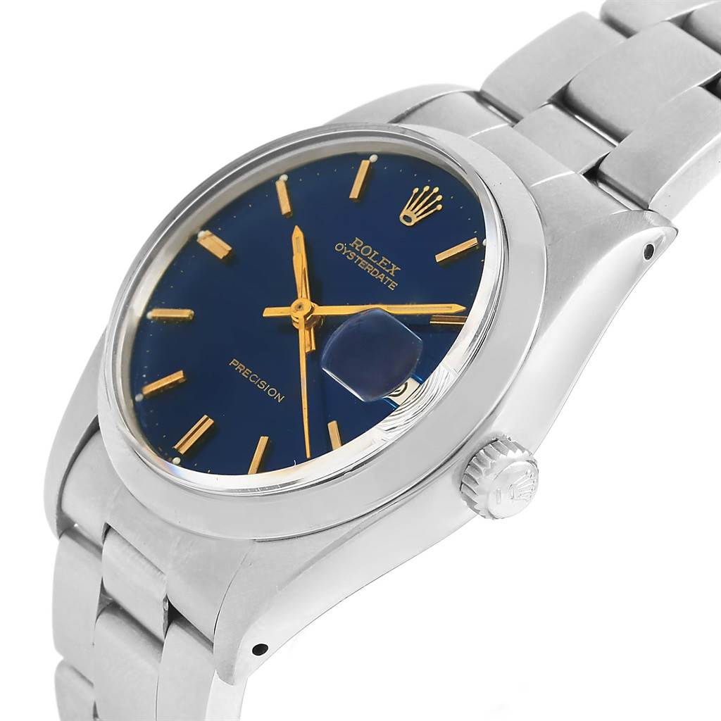 The image shows a side angle view of the Rolex Vintage Collection 6694 Men's Stainless Steel Blue Dial 6694 Men's Stainless Steel Blue Dial Oysterdate watch, displaying the face, bezel, crown, and part of the bracelet.