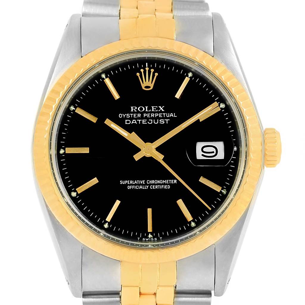 This image shows a front view of the Rolex Vintage Collection 1603 Men's Steel and Gold (two tone) Black Dial 1603 Men's Steel and Gold (two tone) Black Dial Datejust watch, displaying its black dial, gold hour markers, and date window.