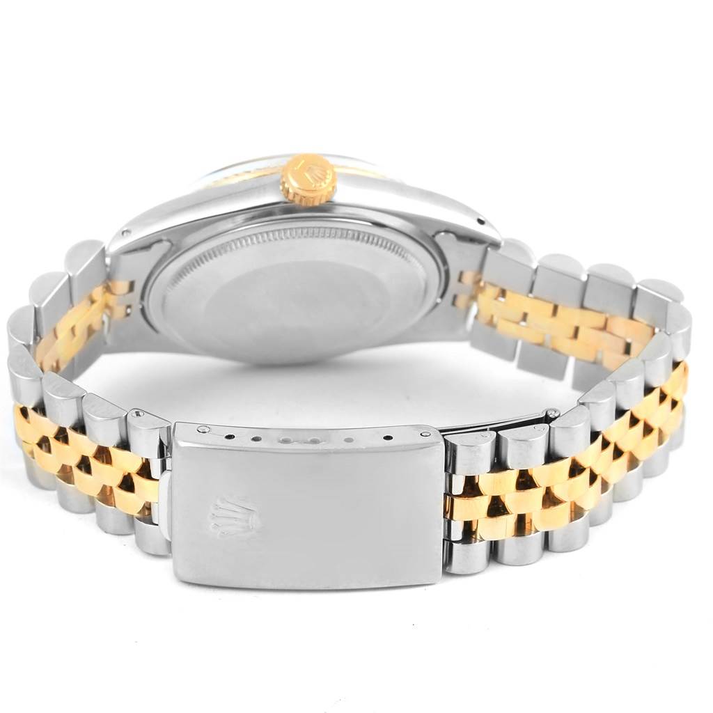 The image shows the back of a Vintage Collection Rolex watch, highlighting the clasp, bracelet, and crown.