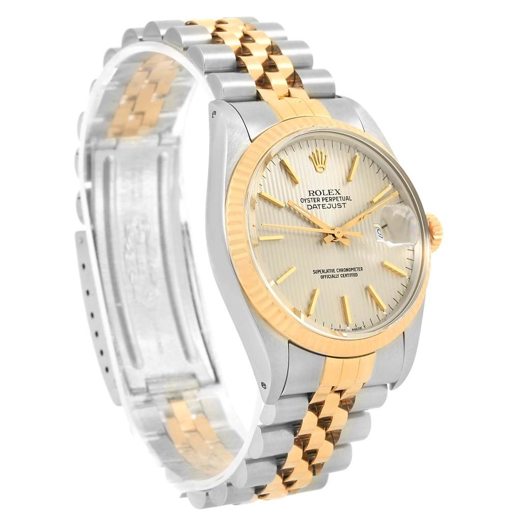 This image shows a side and front view of the Rolex Vintage Collection 16013 Men's Stainless Steel Silver Dial 16013 Men's Stainless Steel Silver Dial model, highlighting its two-tone bracelet and gold bezel.