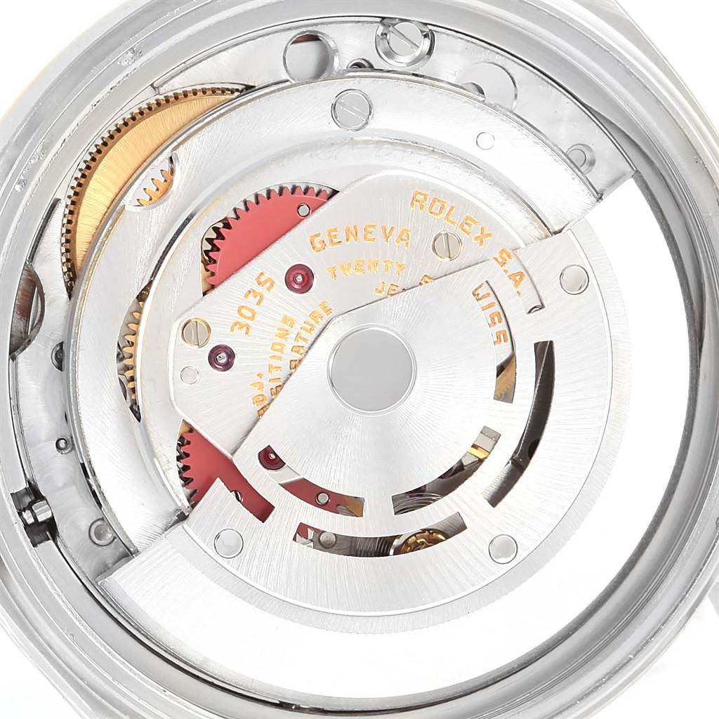 The image shows an internal view of the mechanical movement of the Rolex Vintage Collection 16013 Men's Stainless Steel Silver Dial 16013 Men's Stainless Steel Silver Dial watch, featuring gears and components.