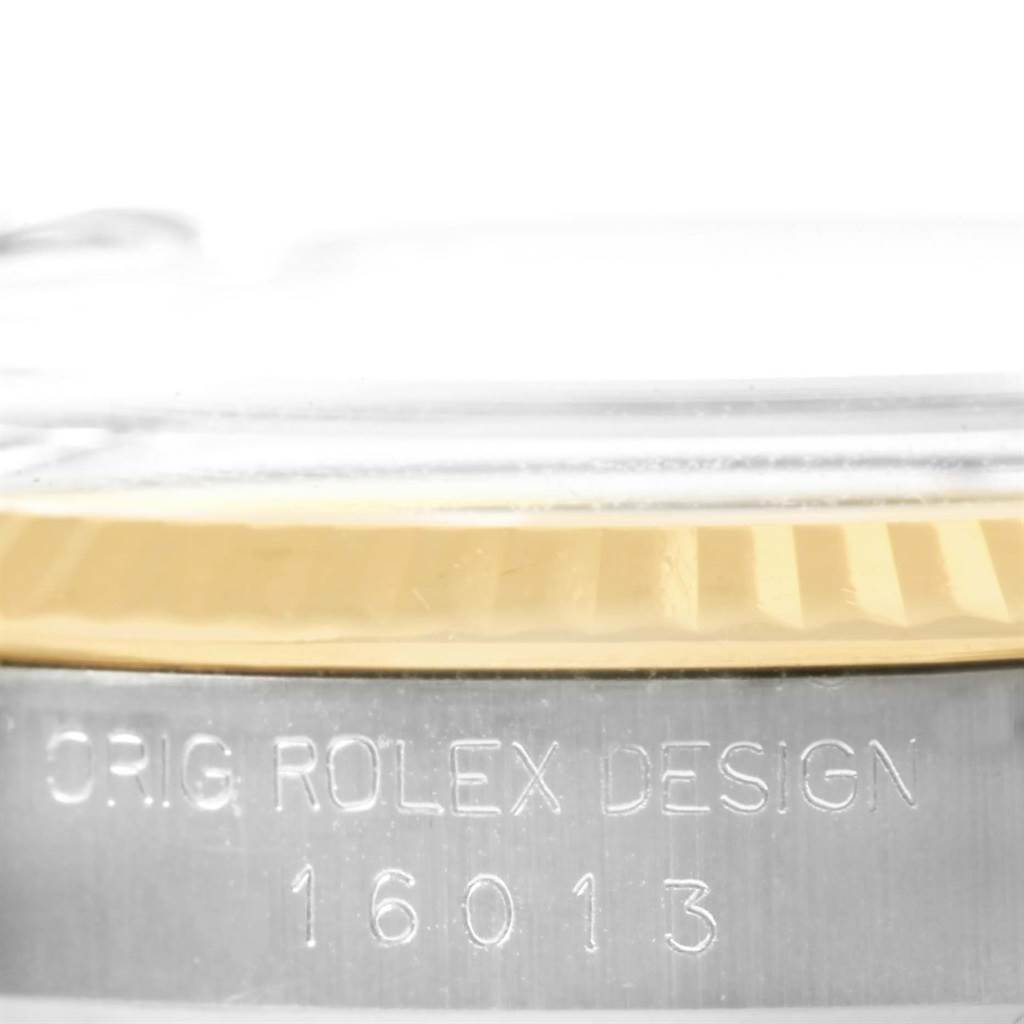 This angle shows a close-up of the side of the Vintage Collection Rolex watch, focusing on the bezel and case with engraved model number 16013.