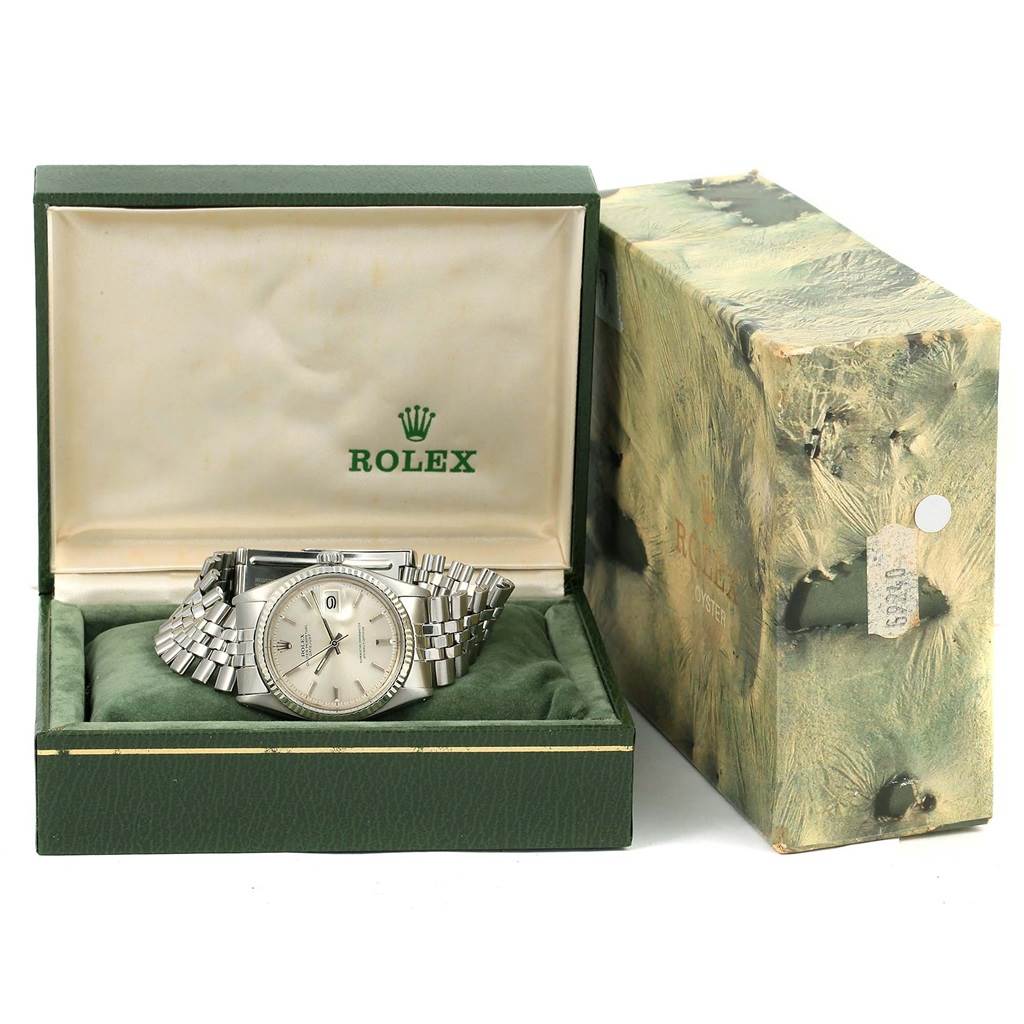 The Vintage Collection Rolex watch is shown at a front angle, displayed inside its branded green box with a cushioned interior.