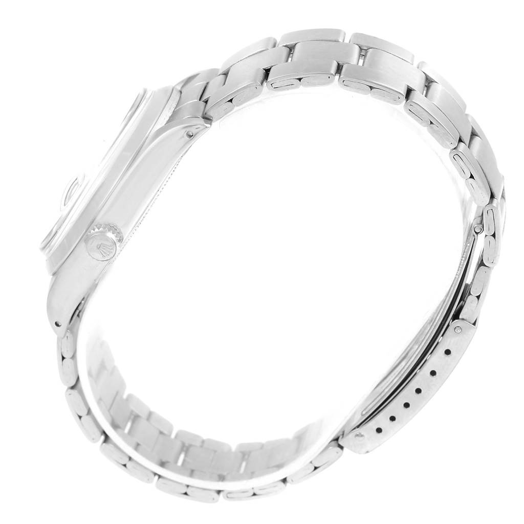 This image shows a side view of the Rolex Vintage Collection 6694 Men's Stainless Steel Silver Dial 6694 Men's Stainless Steel Silver Dial model, featuring its case, crown, and metal bracelet.