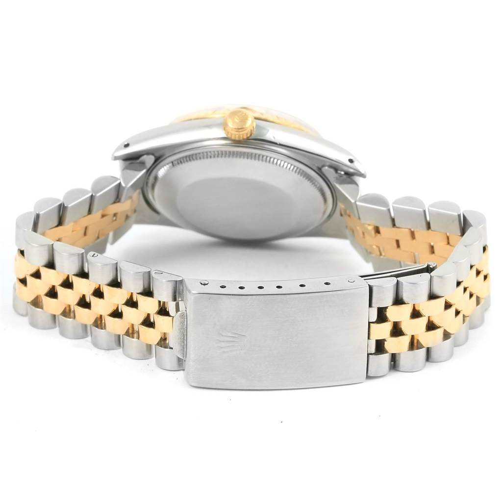 This image shows the backside and clasp of a Vintage Collection Rolex watch at a low angle.