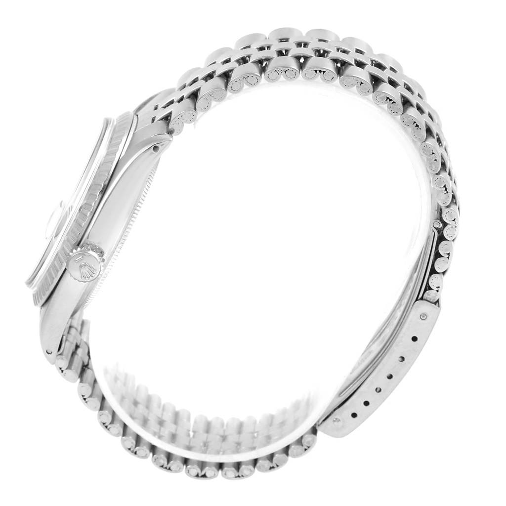 The image shows a side view of the Rolex Vintage Collection 1603 Men's Stainless Steel Silver Dial 1603 Men's Stainless Steel Silver Dial watch, highlighting the case, crown, and bracelet.