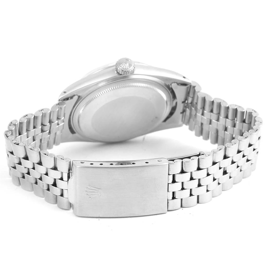 The image shows the back view and clasp of a Vintage Collection Rolex watch, highlighting its metal bracelet and case back.