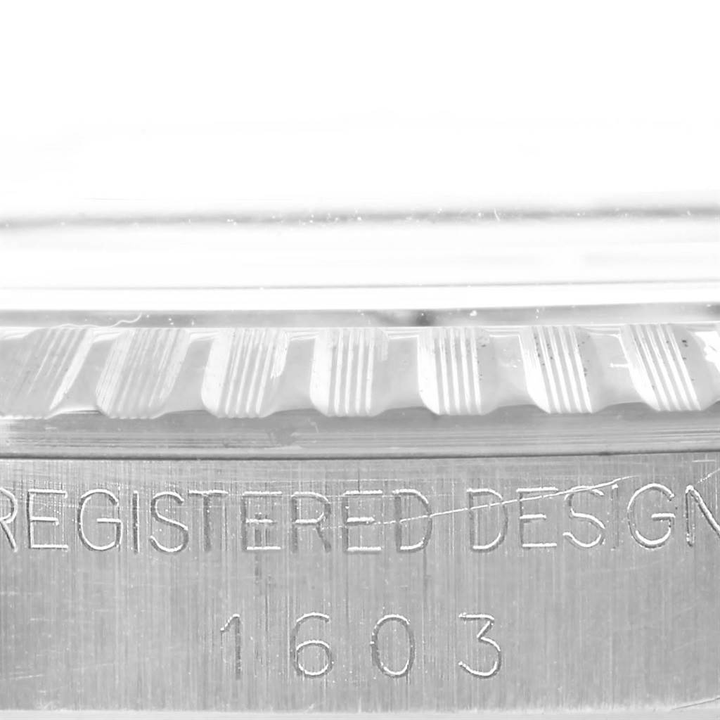 The image shows a close-up of the bezel and casing of a Vintage Collection Rolex watch displaying the serial number 1603.