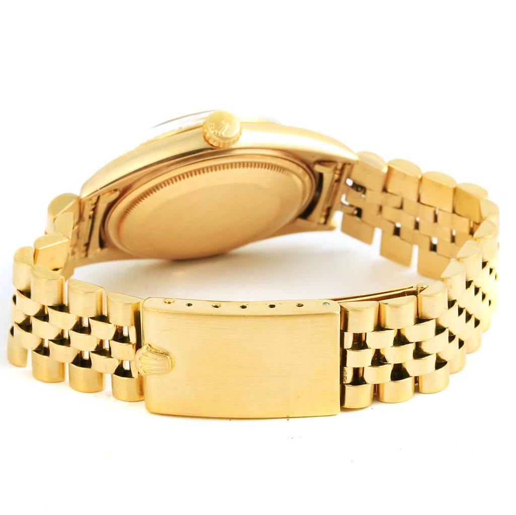 This image shows the back case, crown, and bracelet of a Rolex Vintage Collection 1601 Men's Yellow Gold Champagne Dial 1601 Men's Yellow Gold Champagne Dial watch from a rear angle.