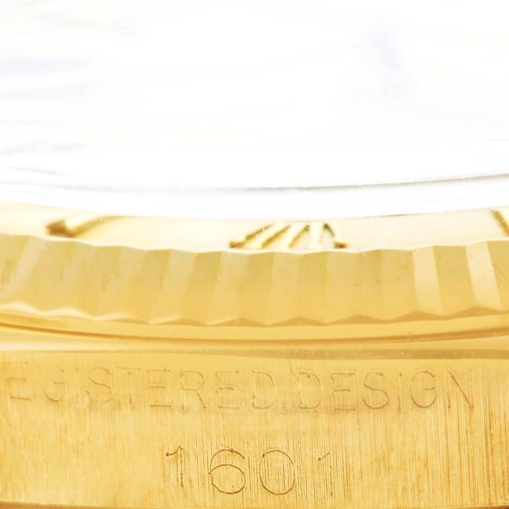 The image shows a close-up of the case side of the Rolex Vintage Collection 1601 Men's Yellow Gold Champagne Dial 1601 Men's Yellow Gold Champagne Dial model, displaying the "REGISTERED DESIGN" and model number "1601".
