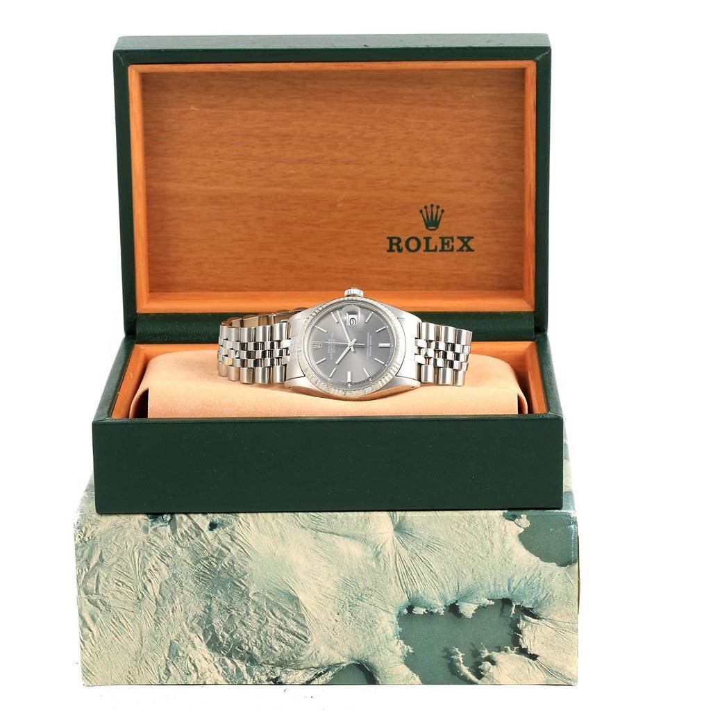 The Vintage Collection Rolex watch is shown from a front angle in an open Rolex box.