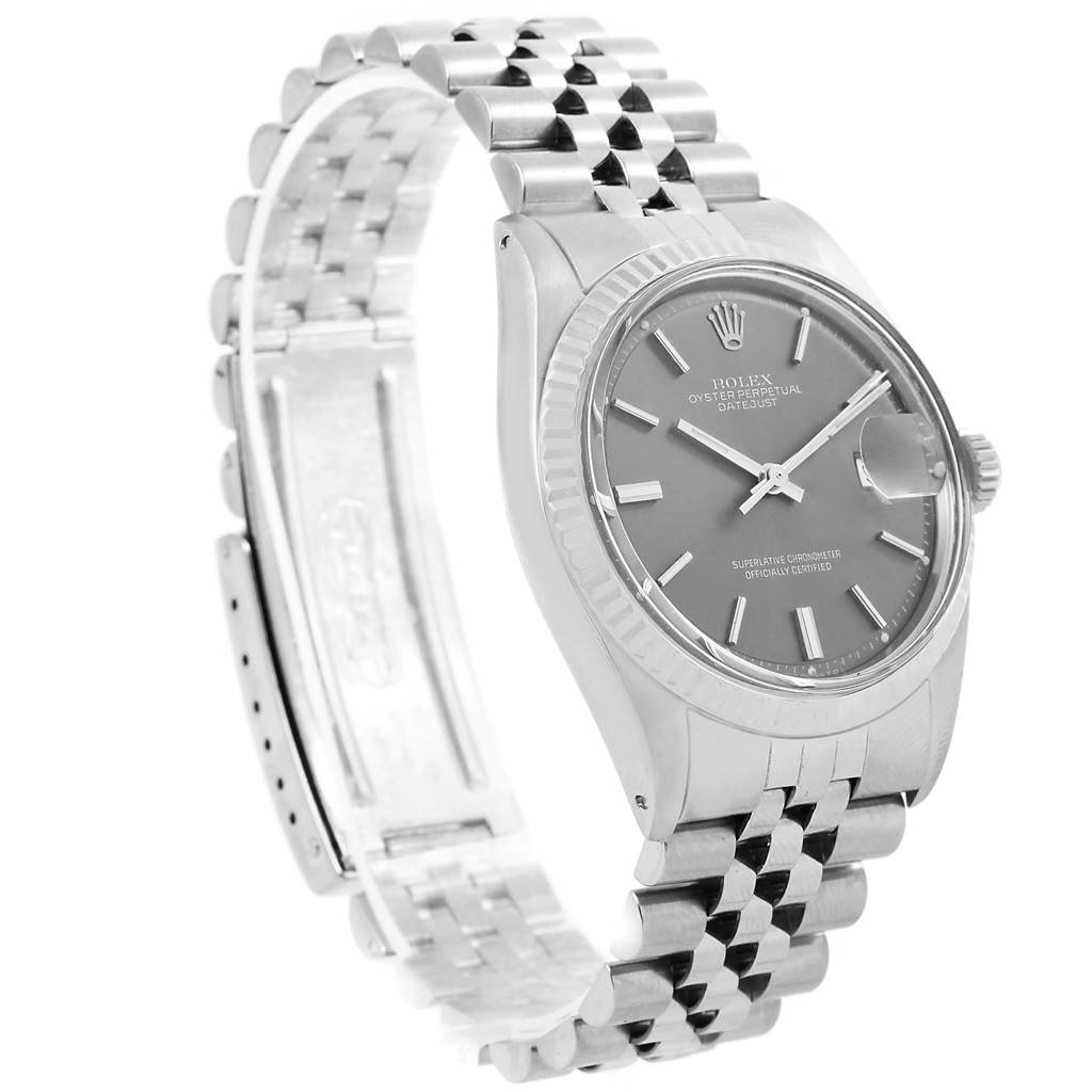 The Rolex Vintage Collection 1601 Men's Stainless Steel Grey Dial 1601 Men's Stainless Steel Grey Dial watch is shown at a side angle, featuring its dial, crown, and partially open metal bracelet.