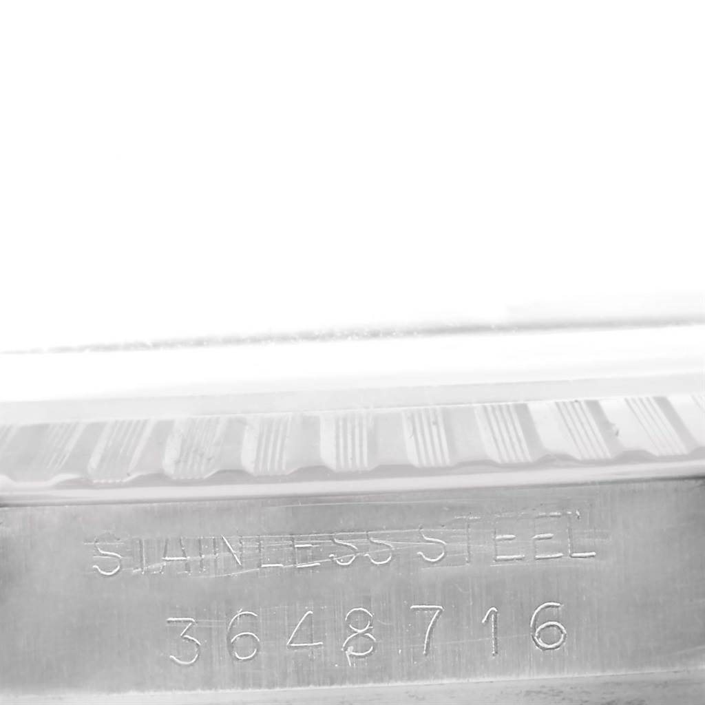 The image shows the side engraving on the stainless steel case of a Rolex Vintage Collection 1603 Men's Stainless Steel Silver Dial 1603 Men's Stainless Steel Silver Dial watch.