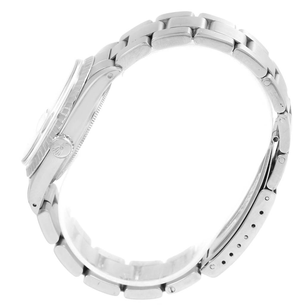 The image shows a side view of a Rolex Vintage Collection 1603 Men's Stainless Steel Silver Dial 1603 Men's Stainless Steel Silver Dial watch, focusing on the case, crown, and metal bracelet.