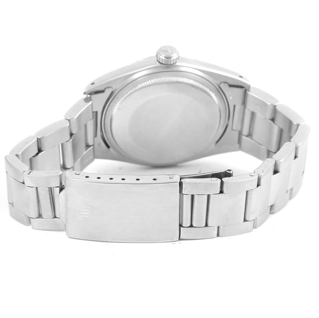 The image shows the back view of a Rolex Vintage Collection 1603 Men's Stainless Steel Silver Dial 1603 Men's Stainless Steel Silver Dial watch, highlighting its metal bracelet and case back.