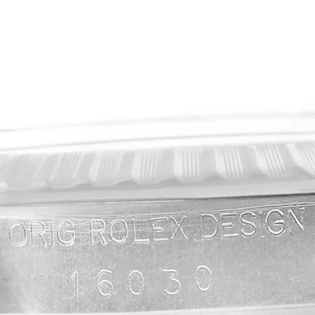 This image shows the engraved bezel and serial number of a Rolex Vintage Collection 16030 Men's Stainless Steel Grey Dial 16030 Men's Stainless Steel Grey Dial model.