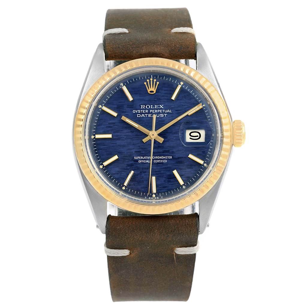 The image shows a frontal view of a Rolex Vintage Collection 1601 Men's Steel and Gold (two tone) Blue Dial 1601 Men's Steel and Gold (two tone) Blue Dial model watch featuring a blue dial, gold bezel, and brown leather strap.