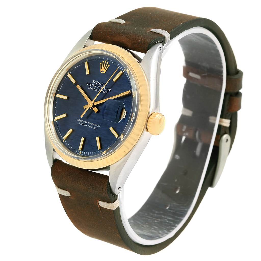 The Rolex Vintage Collection 1601 Men's Steel and Gold (two tone) Blue Dial 1601 Men's Steel and Gold (two tone) Blue Dial watch is shown at a slight angle, focusing on the face, bezel, crown, and leather strap.