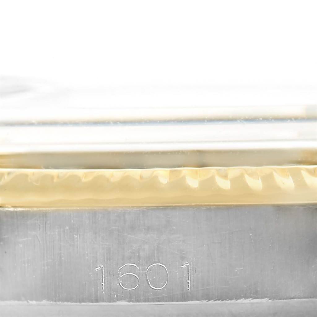 This image shows a close-up side view of the Rolex Vintage Collection 1601 Men's Steel and Gold (two tone) Blue Dial 1601 Men's Steel and Gold (two tone) Blue Dial model 1601, highlighting the engraved model number and fluted bezel.