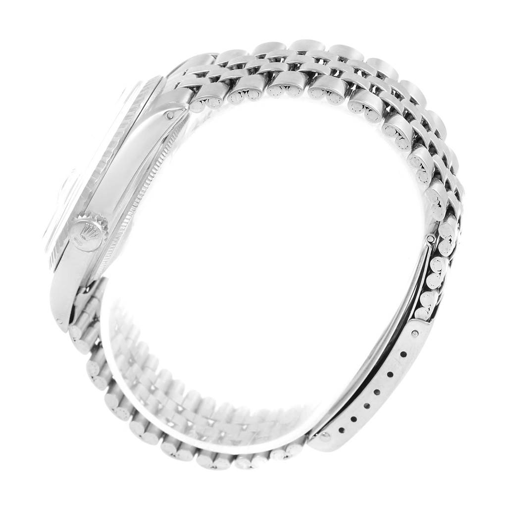 The image shows a side view of the Rolex Vintage Collection 1603 Men's Stainless Steel Silver Dial 1603 Men's Stainless Steel Silver Dial model, highlighting the crown, case, and bracelet.