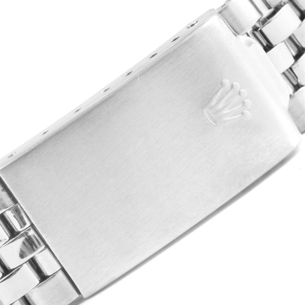 The image shows a close-up of the clasp on the bracelet of a Vintage Collection model by Rolex.