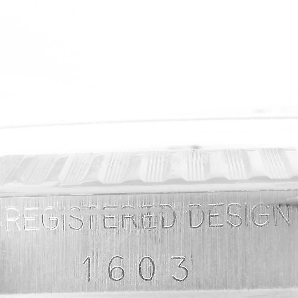 The image shows a close-up side view of the bezel and casing of the Vintage Collection Rolex model 1603 watch.