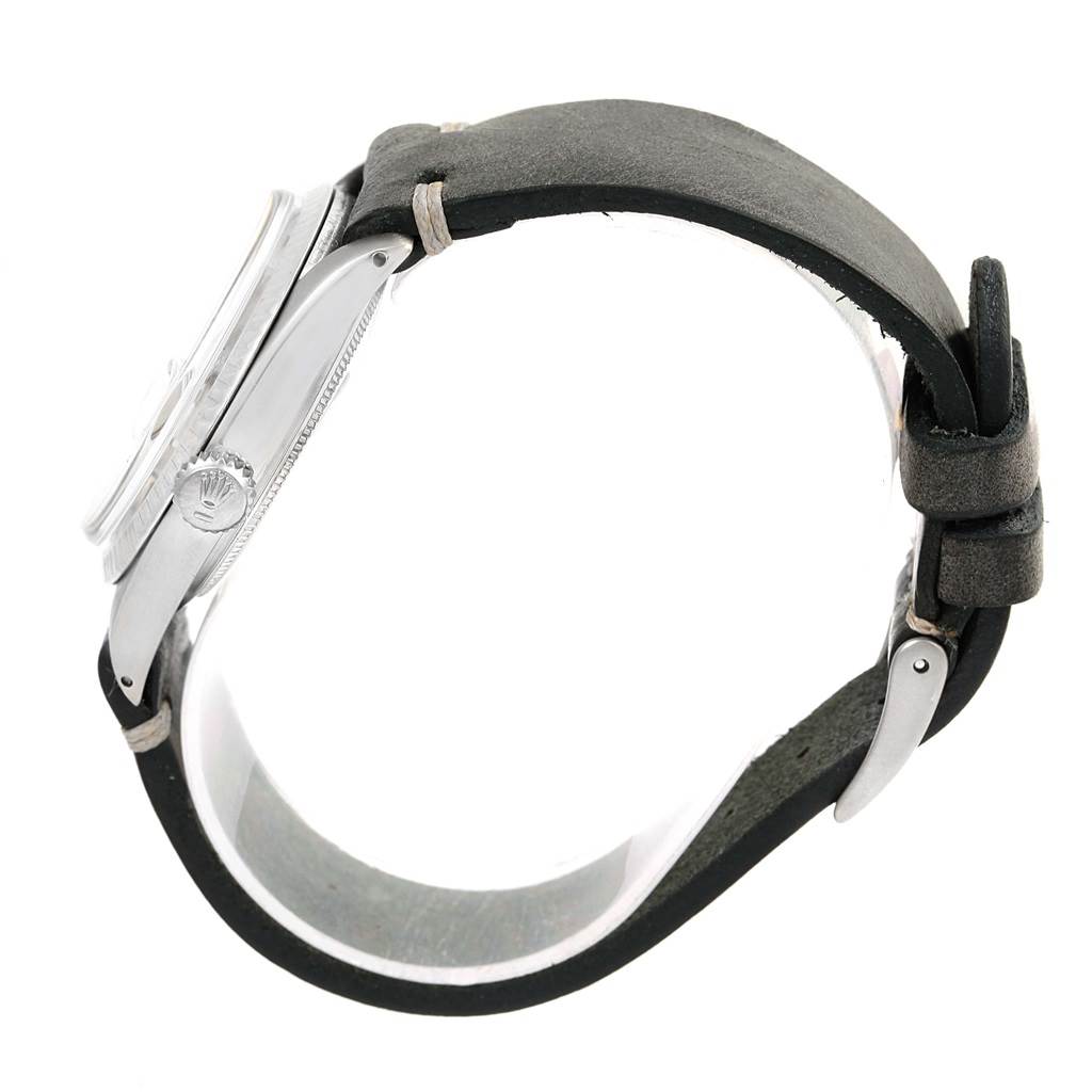 The image shows a side view of the Rolex Vintage Collection 1601 Men's Stainless Steel Silver Dial 1601 Men's Stainless Steel Silver Dial watch with a leather strap and visible crown and case.